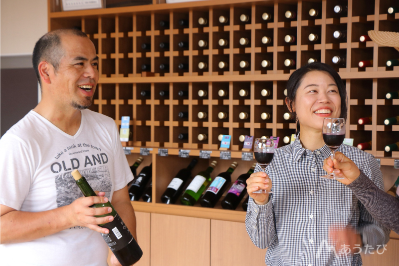 Winery president talking with customers inside the winery