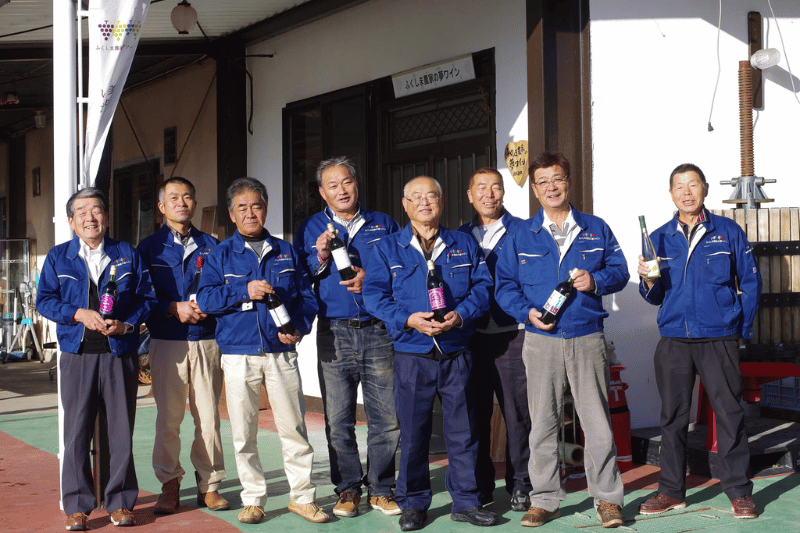 Founding members of a local winery posing together