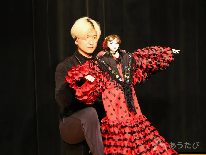 Ryuji performing during a puppet show
