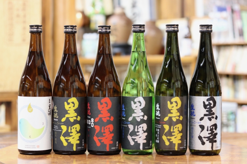 A lineup of Kurosawa Brewery sake bottles