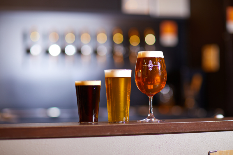Three types of craft beer poured into glasses