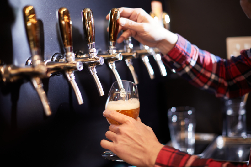Pouring craft beer into a glass