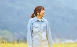 Ryoko smiling in a rice field in rural Japan