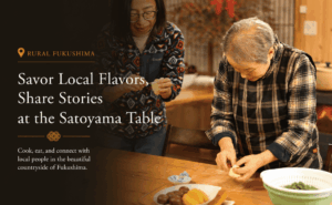 Local host cooking together with guests in a satoyama kitchen in Fukushima